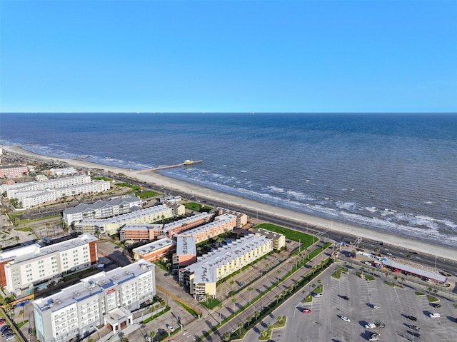 bird's eye view featuring a view of the beach and a water view