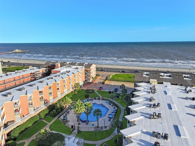 bird's eye view with a water view and a beach view