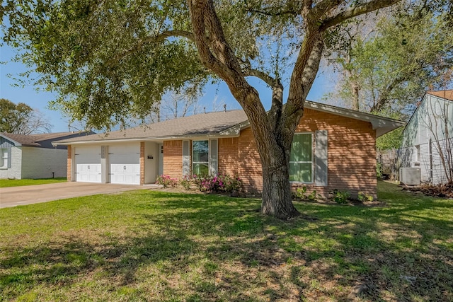 ranch-style home featuring an attached garage, brick siding, driveway, and a front yard