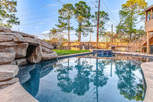 view of pool featuring a fenced backyard, stairs, and a fenced in pool