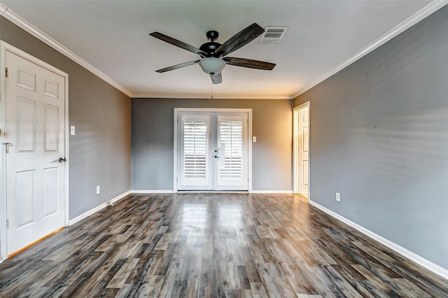 unfurnished room featuring baseboards, visible vents, wood finished floors, and french doors