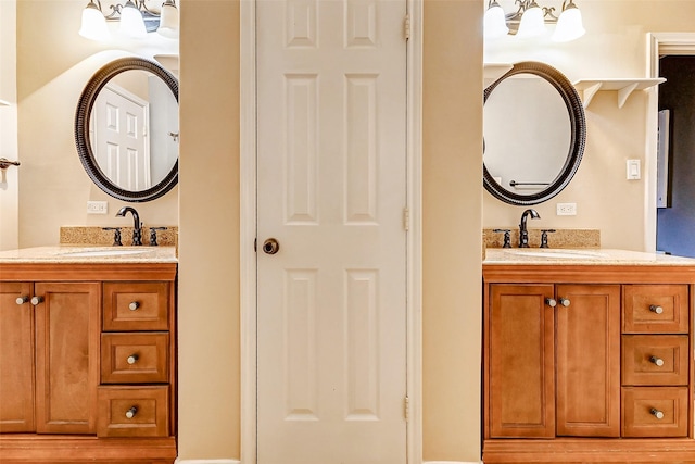 full bathroom featuring a closet, two vanities, and a sink