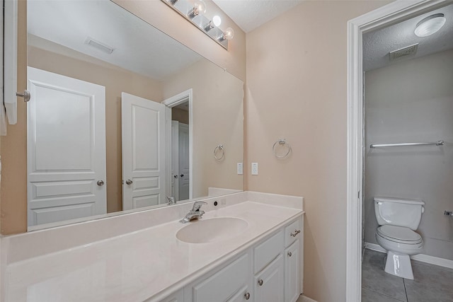 bathroom featuring vanity, tile patterned floors, toilet, and visible vents