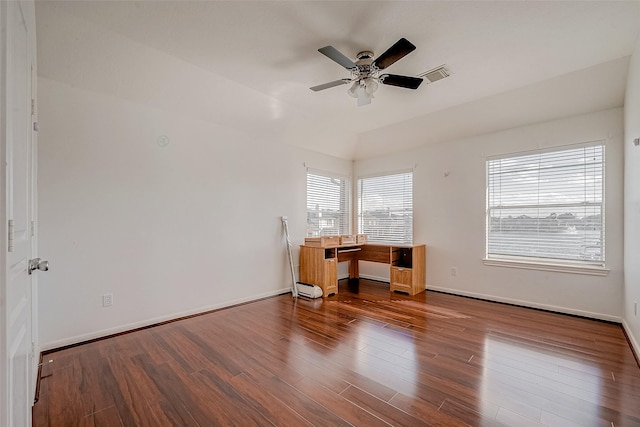 spare room with visible vents, baseboards, ceiling fan, and wood finished floors