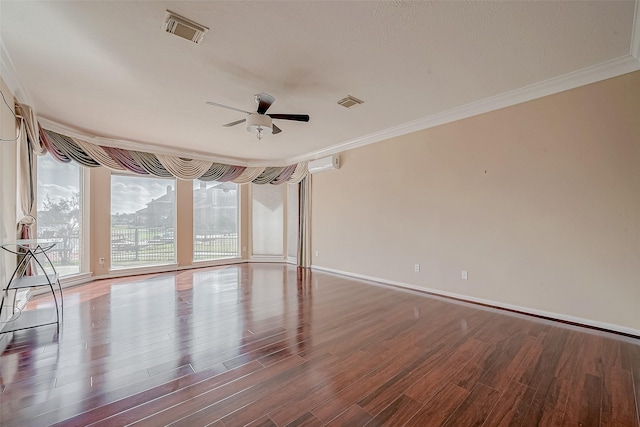 unfurnished room featuring visible vents, ornamental molding, wood finished floors, floor to ceiling windows, and ceiling fan