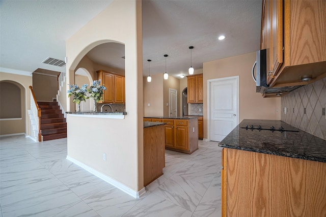 kitchen with visible vents, marble finish floor, stainless steel microwave, and black electric stovetop