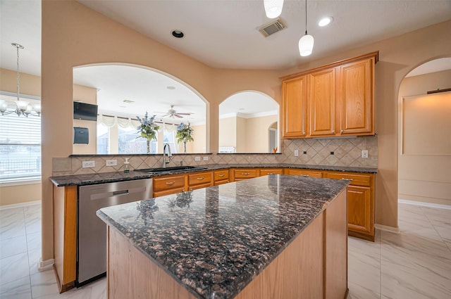 kitchen featuring visible vents, arched walkways, a sink, stainless steel dishwasher, and marble finish floor