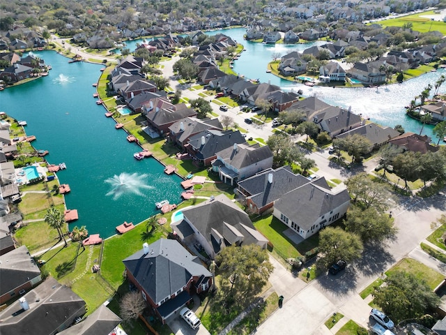 aerial view with a residential view and a water view