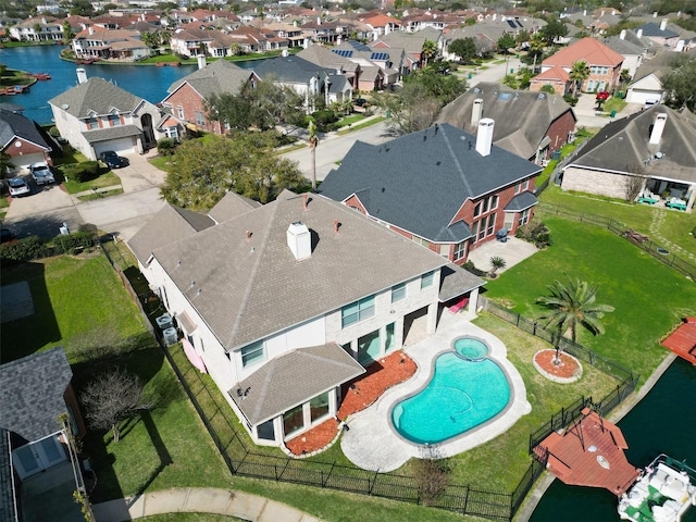 bird's eye view with a residential view and a water view