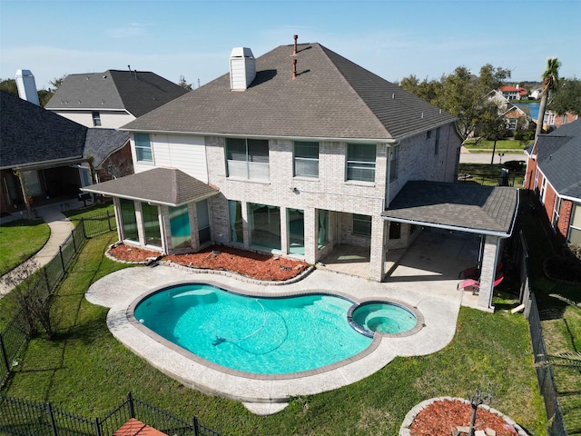 view of swimming pool featuring a yard, a patio area, and a fenced backyard