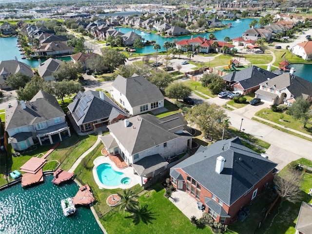 birds eye view of property with a residential view and a water view