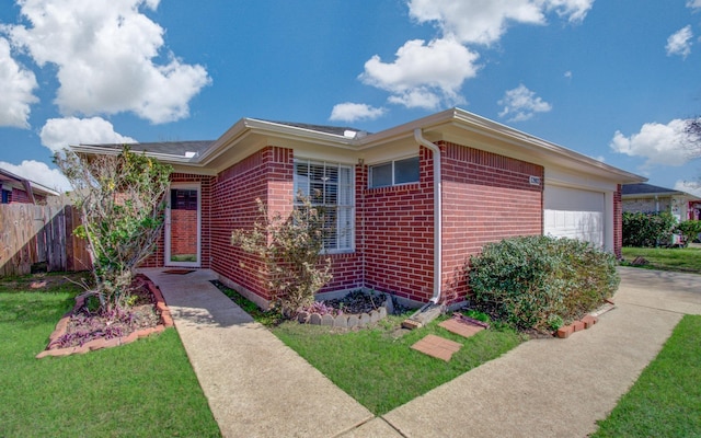 single story home featuring a garage, concrete driveway, brick siding, and fence