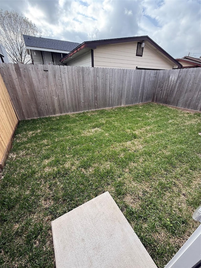 view of yard featuring a fenced backyard