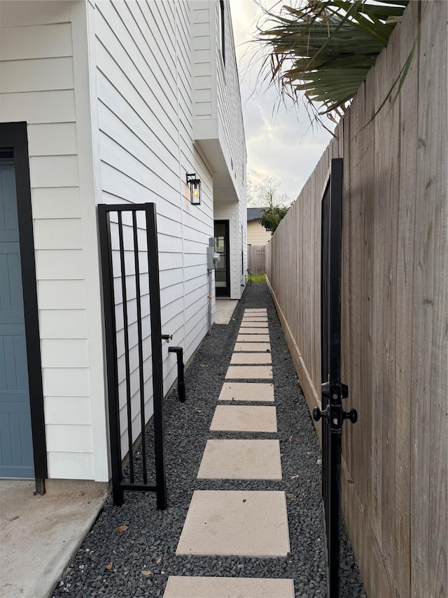 view of side of home featuring a fenced backyard