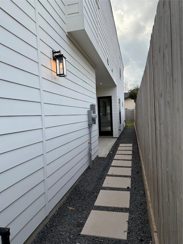 view of side of property with fence