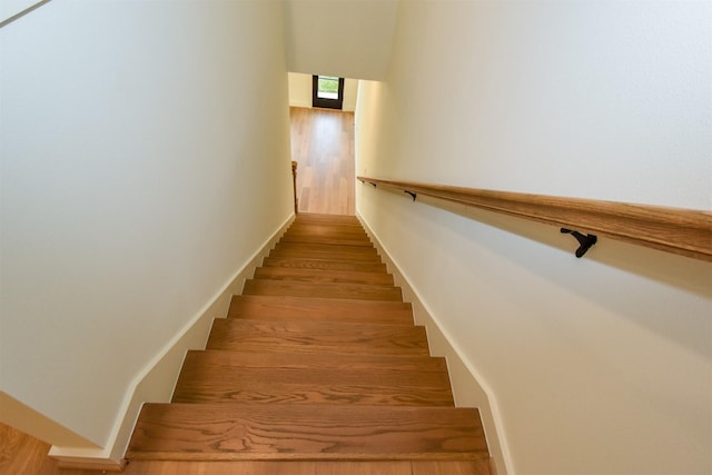 staircase with wood finished floors