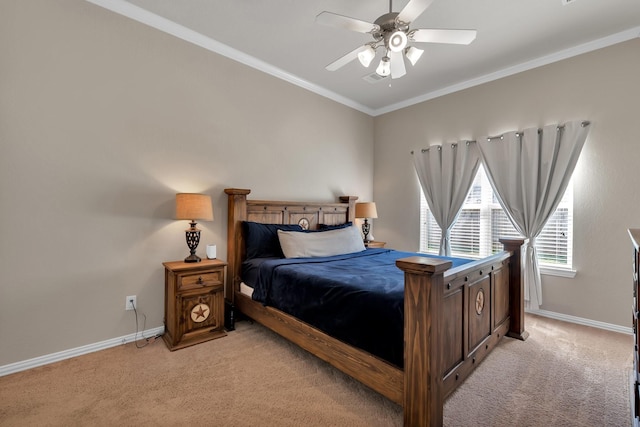 bedroom with light carpet, ceiling fan, baseboards, and crown molding