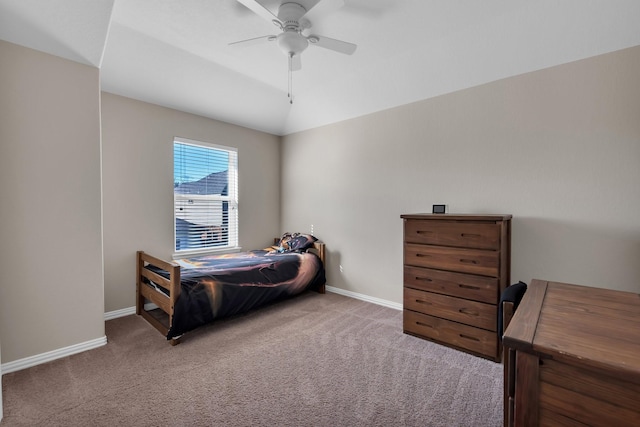 bedroom with vaulted ceiling, carpet, a ceiling fan, and baseboards