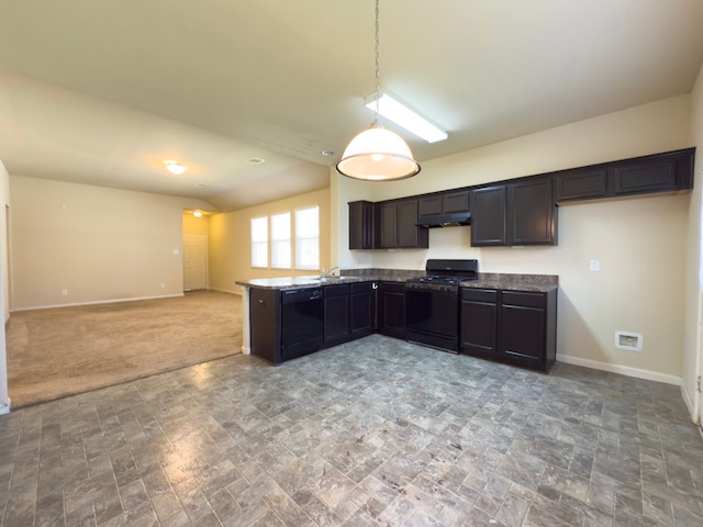 kitchen featuring a peninsula, black appliances, baseboards, and hanging light fixtures