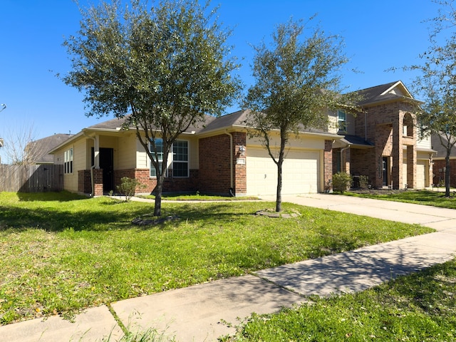 view of front of home featuring an attached garage, a front yard, concrete driveway, and brick siding