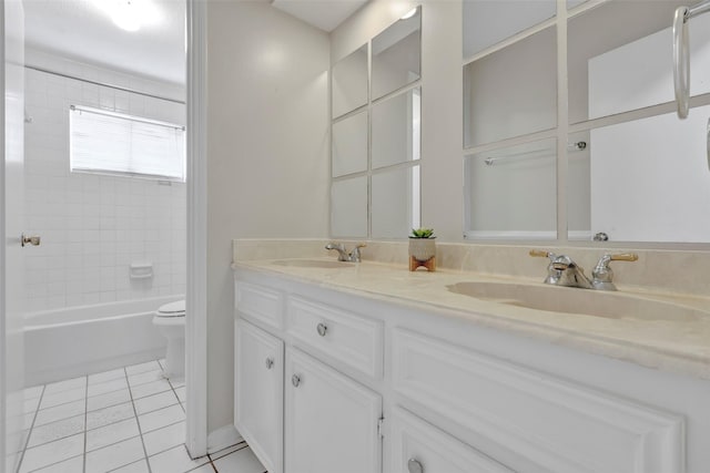 full bath with tile patterned flooring, a sink, toilet, and double vanity