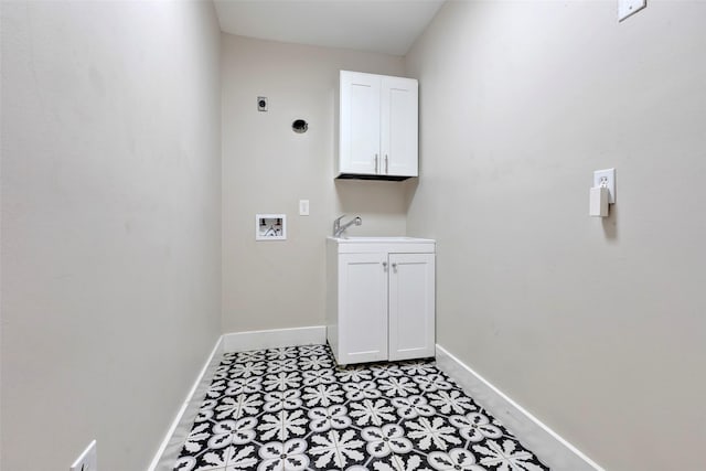 washroom featuring hookup for a washing machine, a sink, baseboards, cabinet space, and electric dryer hookup