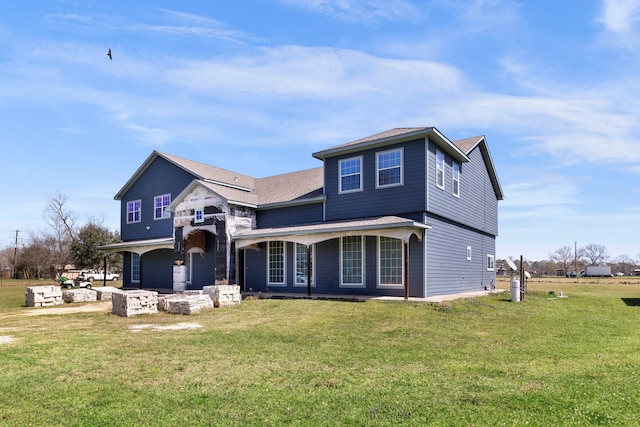 view of front of property featuring a front yard