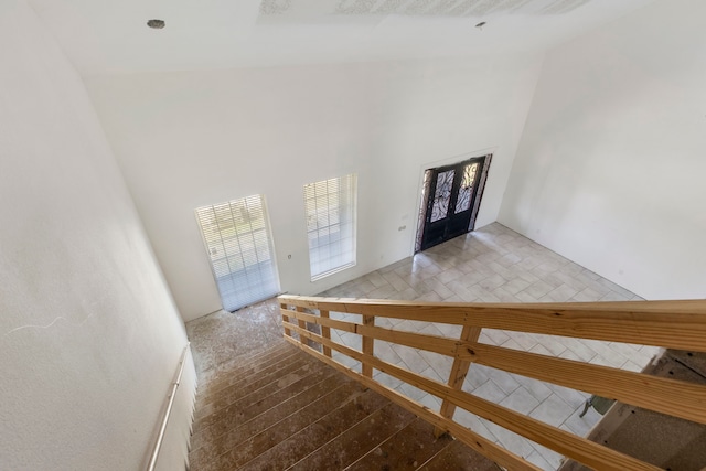 foyer featuring a high ceiling and wood finished floors