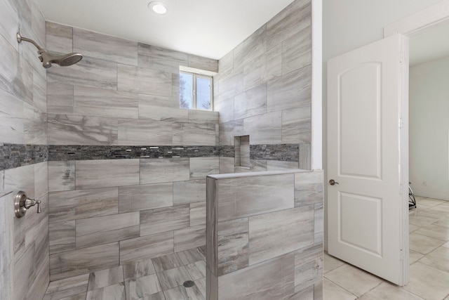 bathroom with tiled shower