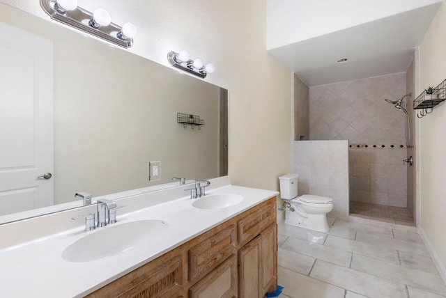 full bathroom featuring toilet, tile patterned flooring, walk in shower, and a sink