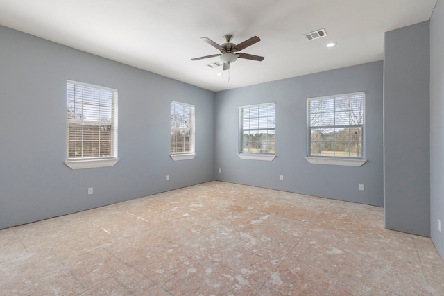 2464 N Walker Rd, Cleveland, TX 77328 - empty room with ceiling fan, plenty of natural light, and recessed lighting