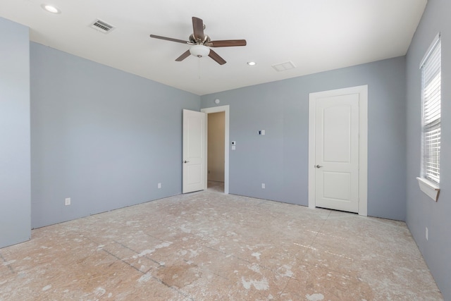 spare room featuring visible vents and ceiling fan