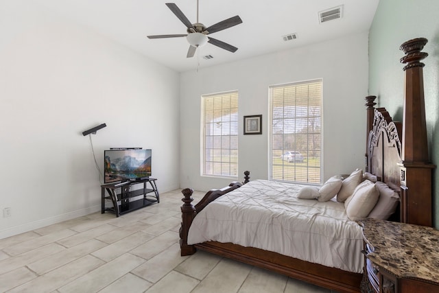 bedroom with ceiling fan, visible vents, and baseboards