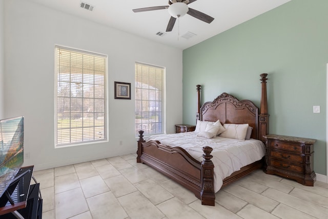 bedroom with baseboards and visible vents