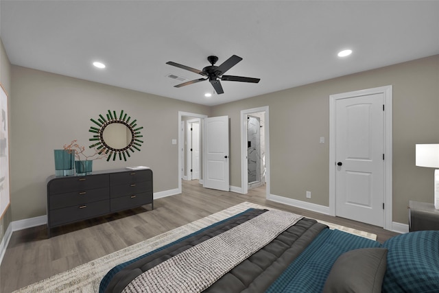 bedroom featuring light wood-style flooring, baseboards, and recessed lighting