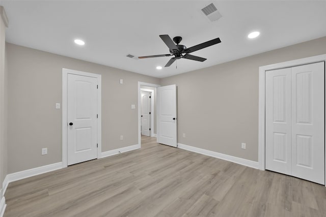 unfurnished bedroom featuring light wood-style flooring, recessed lighting, visible vents, and baseboards