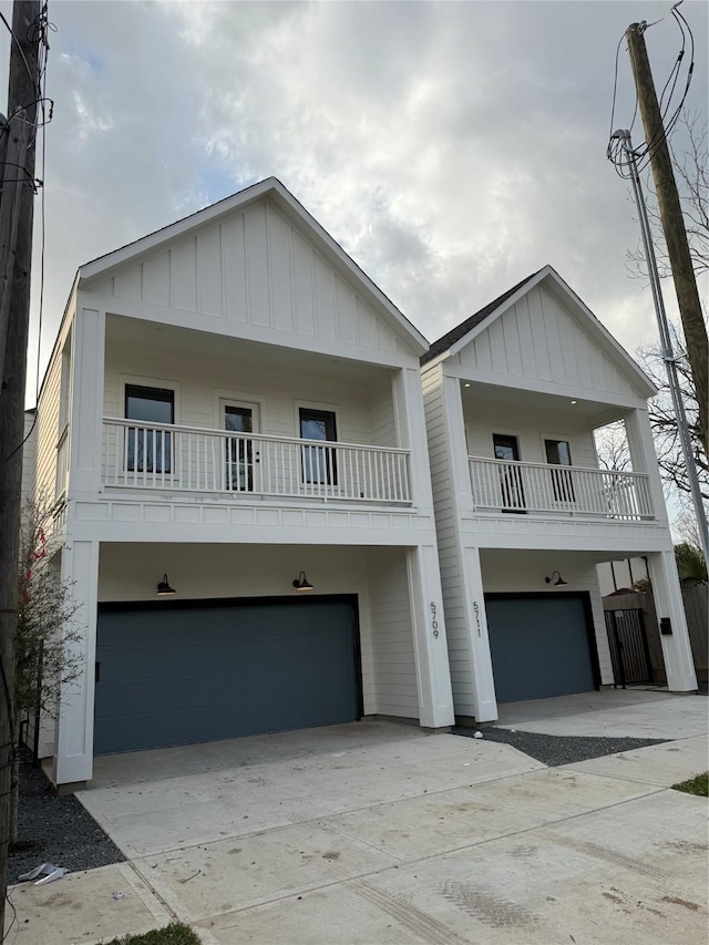 view of front of home featuring driveway, an attached garage, and board and batten siding