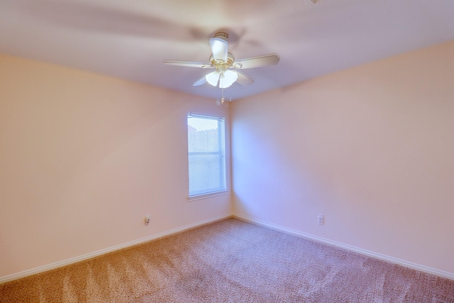 unfurnished room with light carpet, ceiling fan, and baseboards