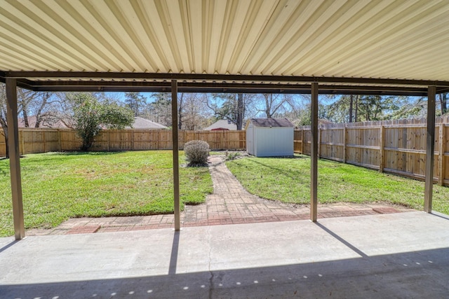 view of patio featuring a fenced backyard, a storage shed, and an outdoor structure