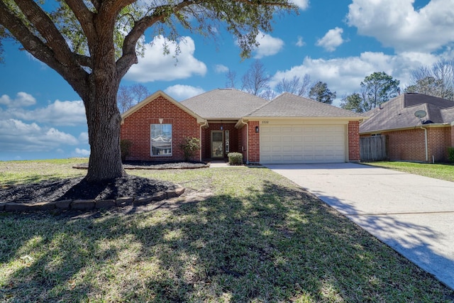 ranch-style house with brick siding, driveway, a front yard, and a garage