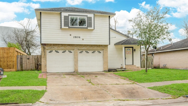 view of front of home featuring a garage, a front lawn, fence, and brick siding