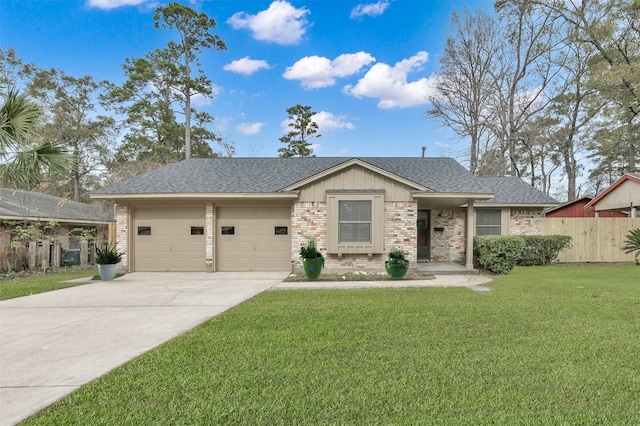 view of front of house featuring a garage, driveway, fence, a front lawn, and brick siding