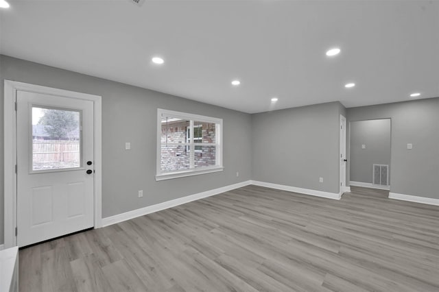 entrance foyer featuring recessed lighting, wood finished floors, visible vents, and baseboards