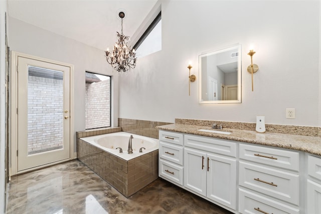 bathroom featuring lofted ceiling, concrete floors, visible vents, vanity, and a bath