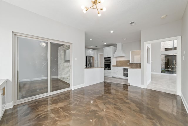 unfurnished living room with a chandelier, recessed lighting, a fireplace, visible vents, and baseboards