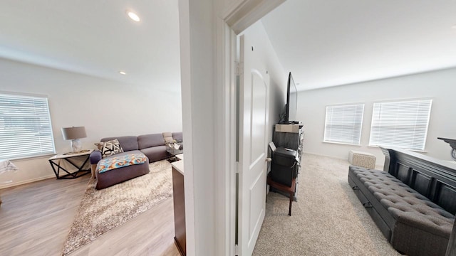 living room with baseboards and recessed lighting