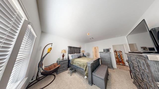 bedroom with light colored carpet