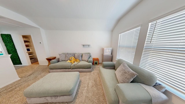 carpeted living room with lofted ceiling