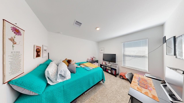 bedroom featuring carpet floors and visible vents