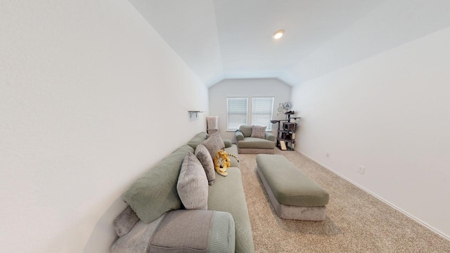 carpeted living area with lofted ceiling